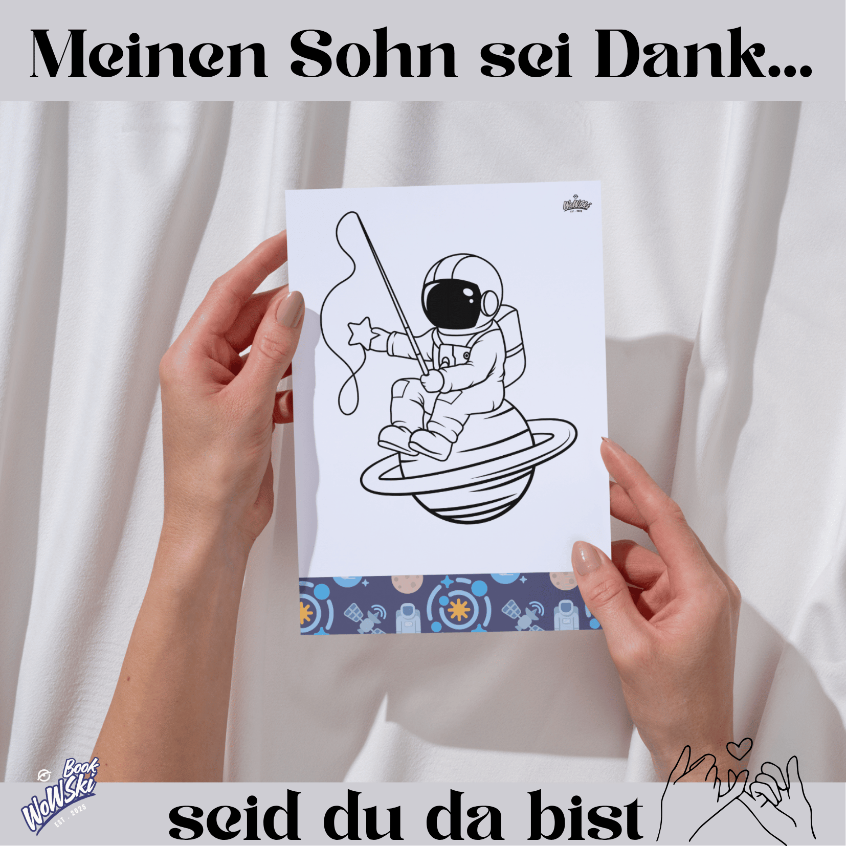 Text: Mein Sohn sei dank, seid du da bist. MockUp: Hände mit Malvorlage: Astronaut sitz auf einem Planeten und angelt Sterne .links unten Logo:"wowski-book"